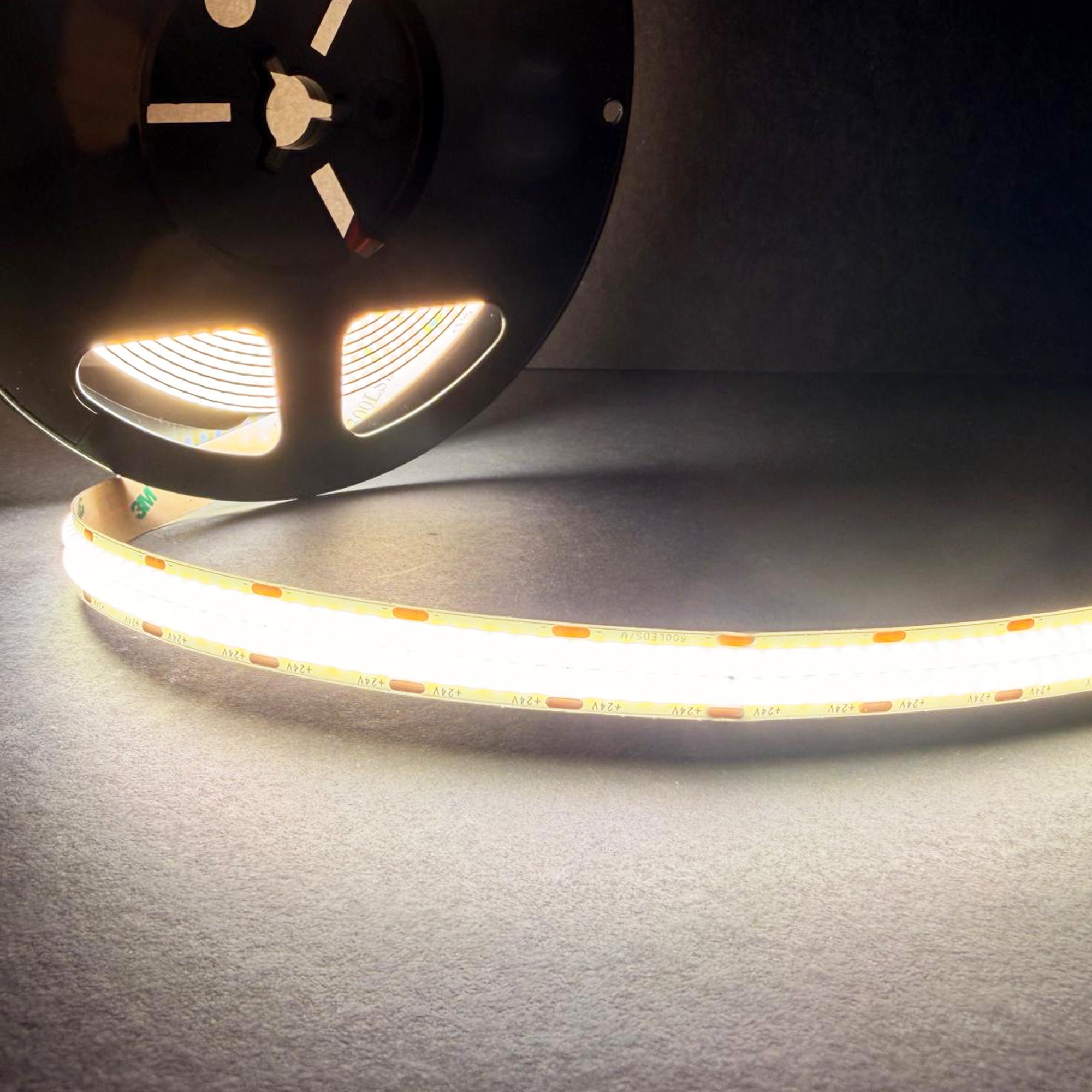 UL certified indoor 24V FCOB double row LED strip light on reel showing bright high density dotless illumination