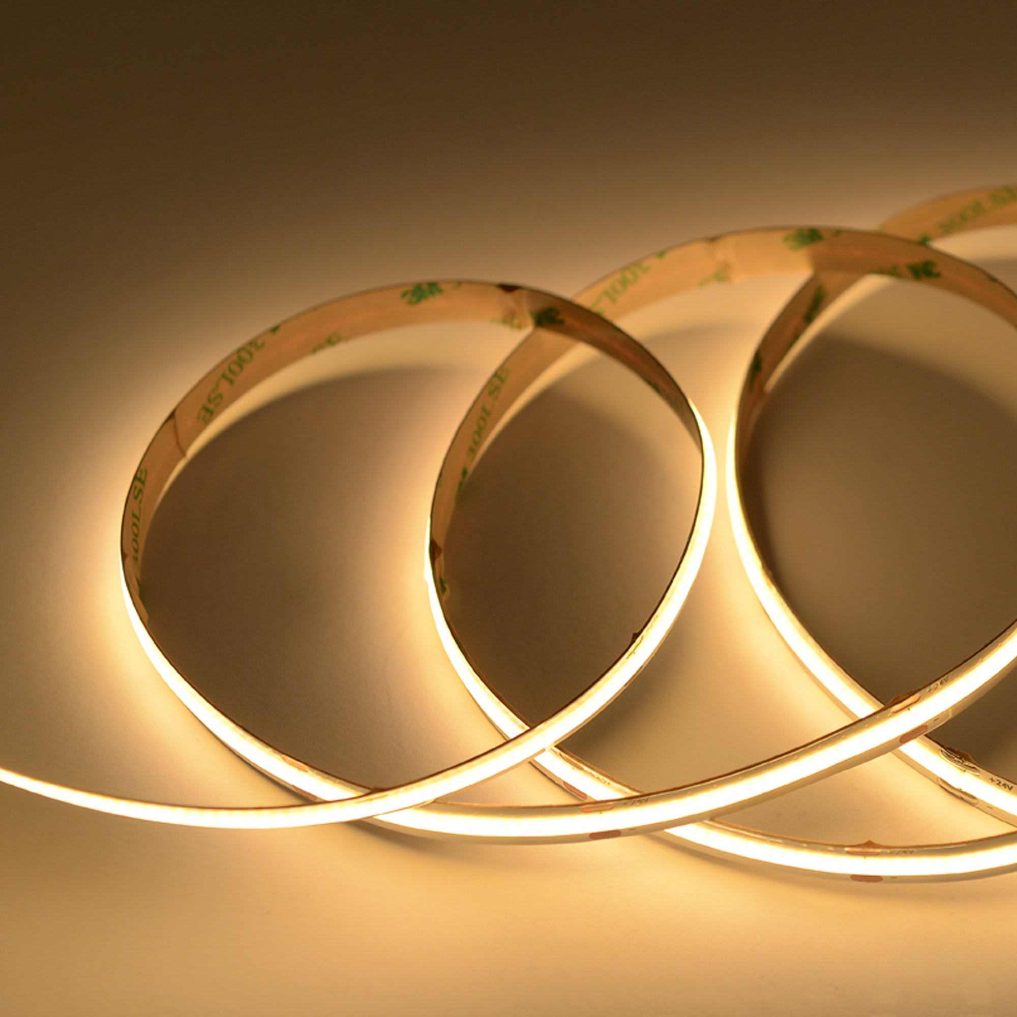 UL certified indoor 24V COB LED strip light 10mm width showing warm white dotless lighting in flexible loop installation