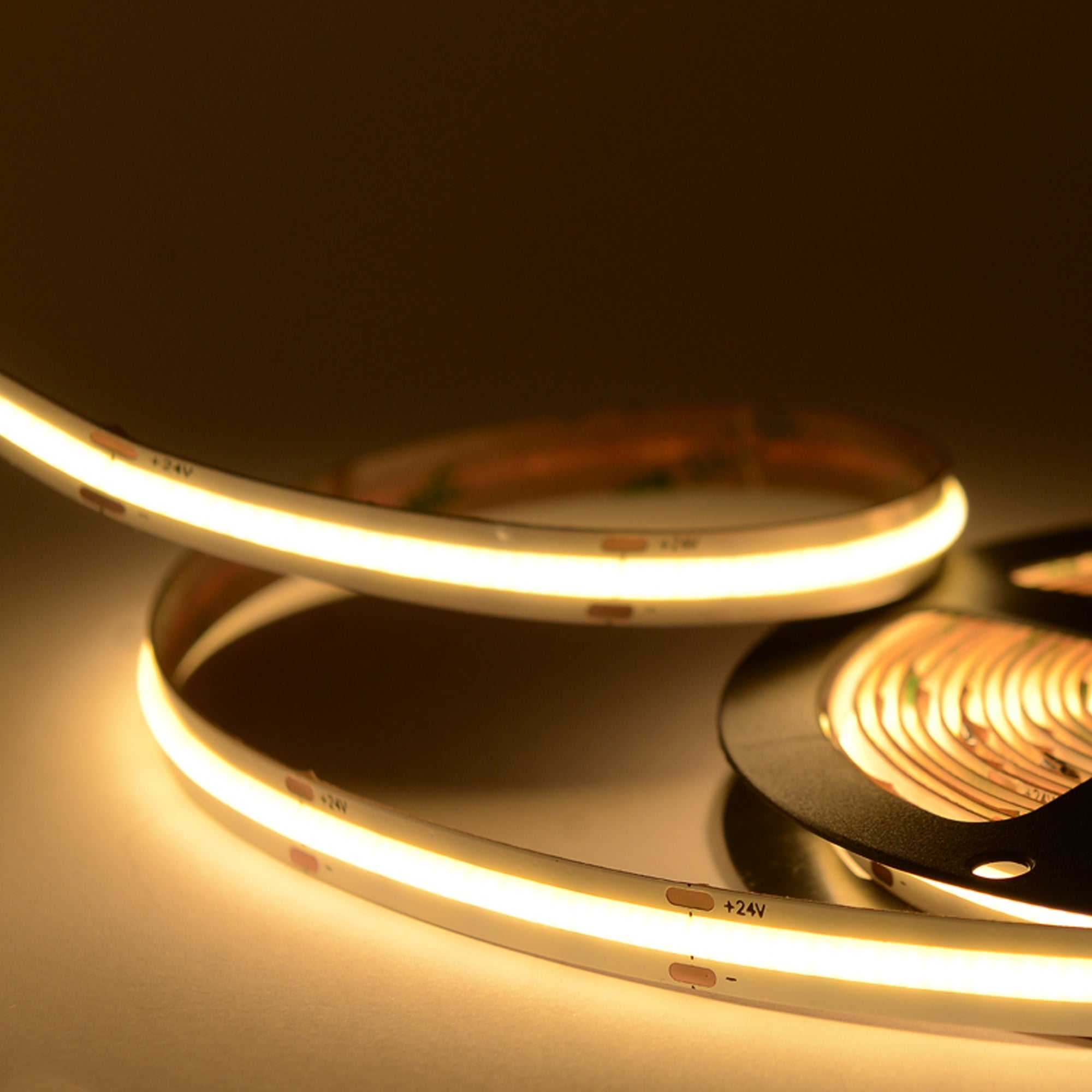 UL certified indoor 24V COB LED strip light 10mm width showing warm white uniform LED lighting without visible dots